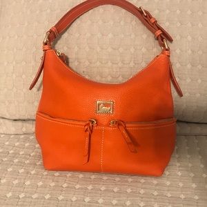 Medium sized Dooney and Burke purse